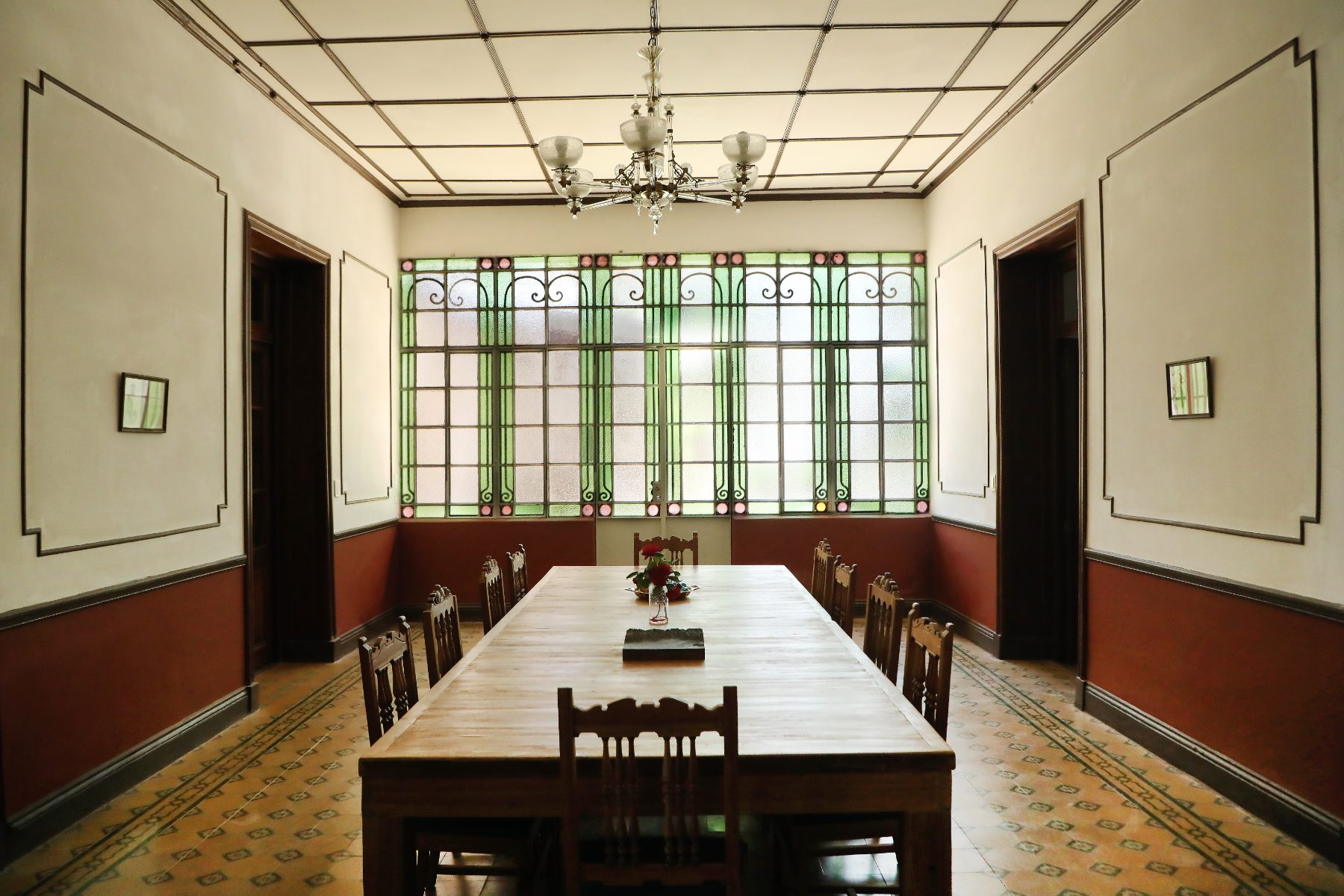 Antique furniture and vintage tiled floors inside Villa Maria-Luisa